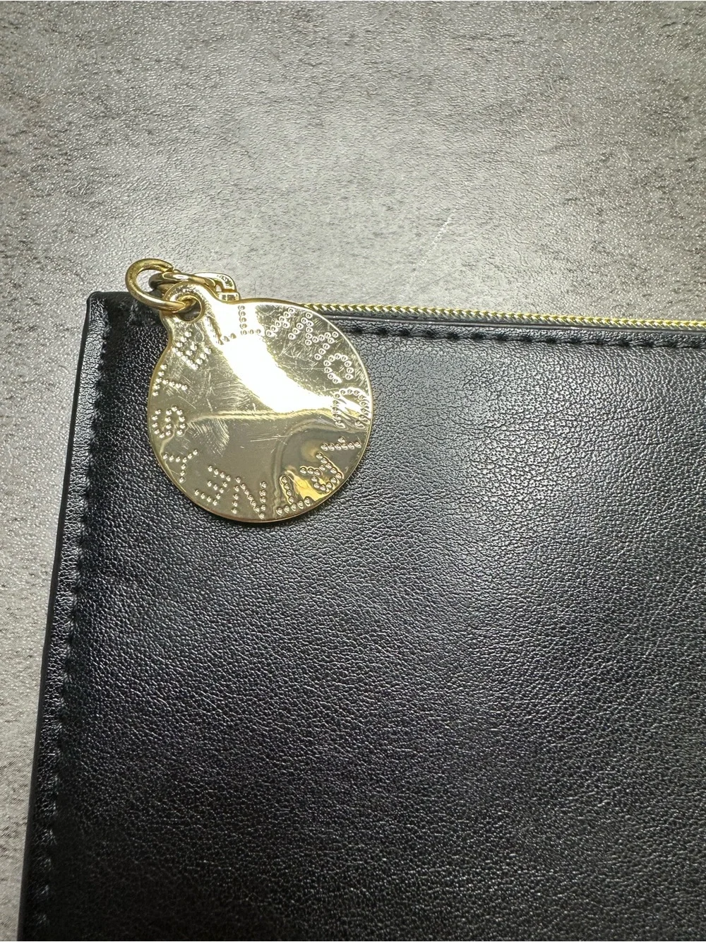 Stella McCartney Black Zip Pouch with Gold Medallion Charm